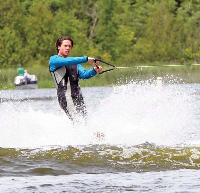 Brad Moloney was making waves after skiing completely around the tow boat on one ski.