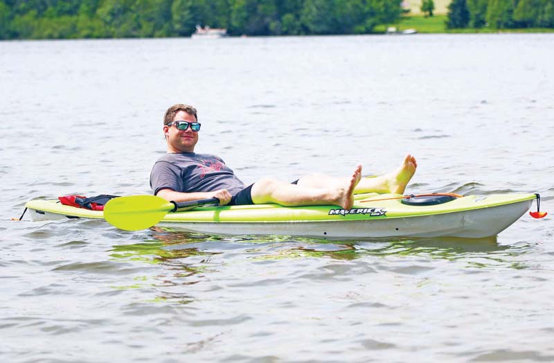 Florian Rosera relaxes in his kayak.