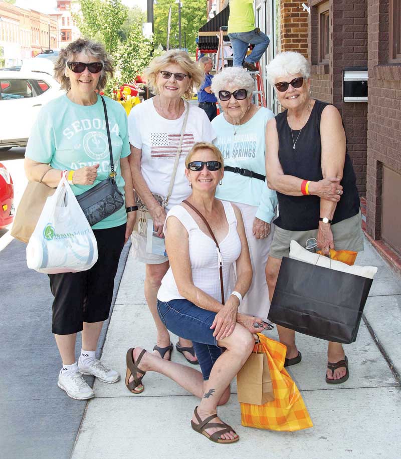 Laurie Evans, Ann Geier, Carol Haroldson, MaryAnn Riegert and Jean Zondlo were camping in Wild Rose, but came to Waupaca to do a little shopping.
