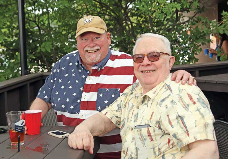 Bryon Gyldenvand and Barry Sanders were enjoying cocktails on the porch at Simpsons while watching the 4th of July parade.