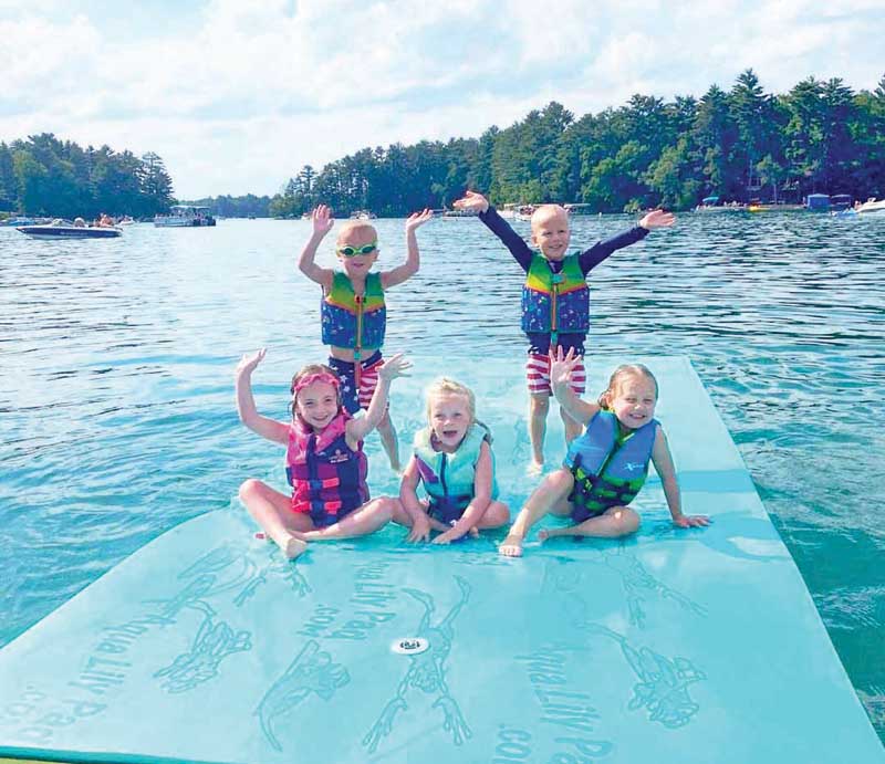 Friends Hallie, Mae, Elliot, Henry and Luke love to swim and spend time together on the Chain!