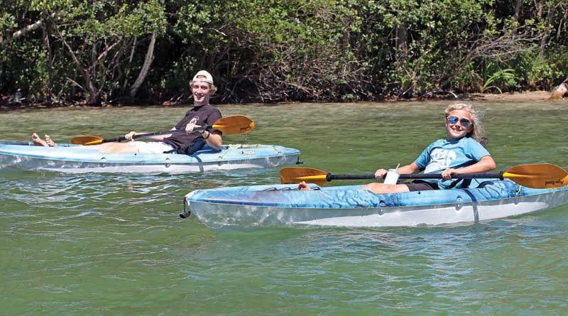 Grayson Clark and Carl Sturm were having fun Kayaking on the Chain O’ Lakes.
