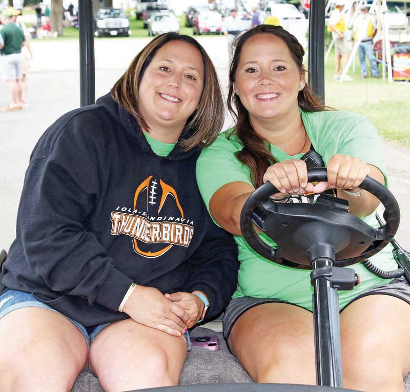 Megan Driebel and Mandy Kriesel were part of the clean up crew at the Iola Car Show.