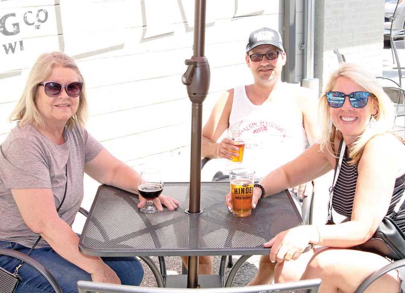 Ronda Stein, Mike Netys and Jenni Stein enjoyed drinks together on a beautiful summer day.
