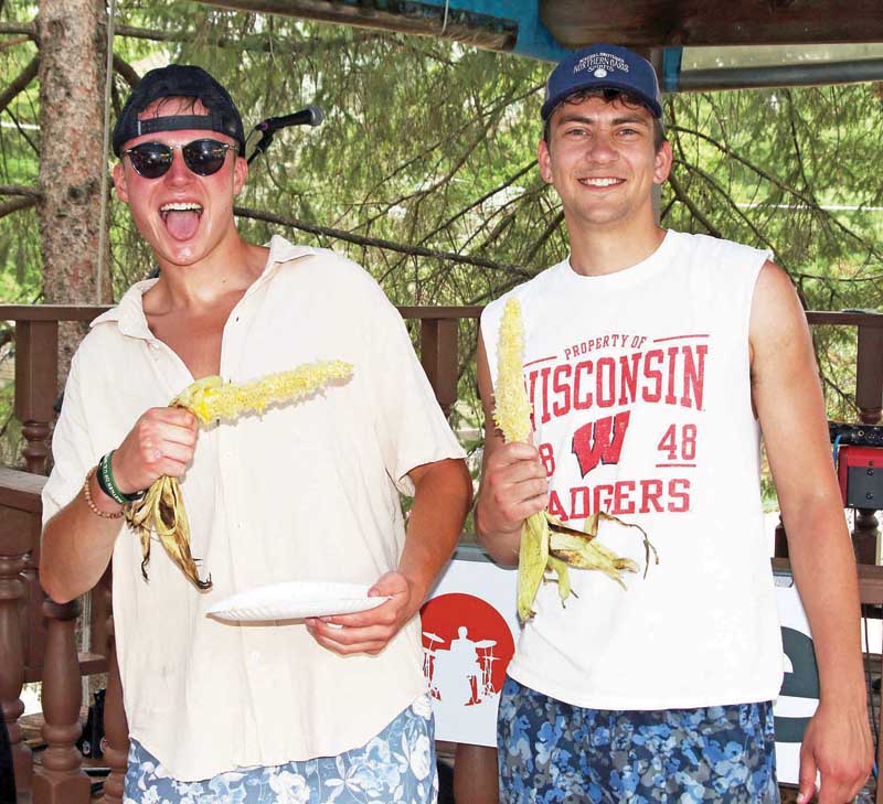 Tristan Koss and Collin Isetts enjoyed some corn on the cob.