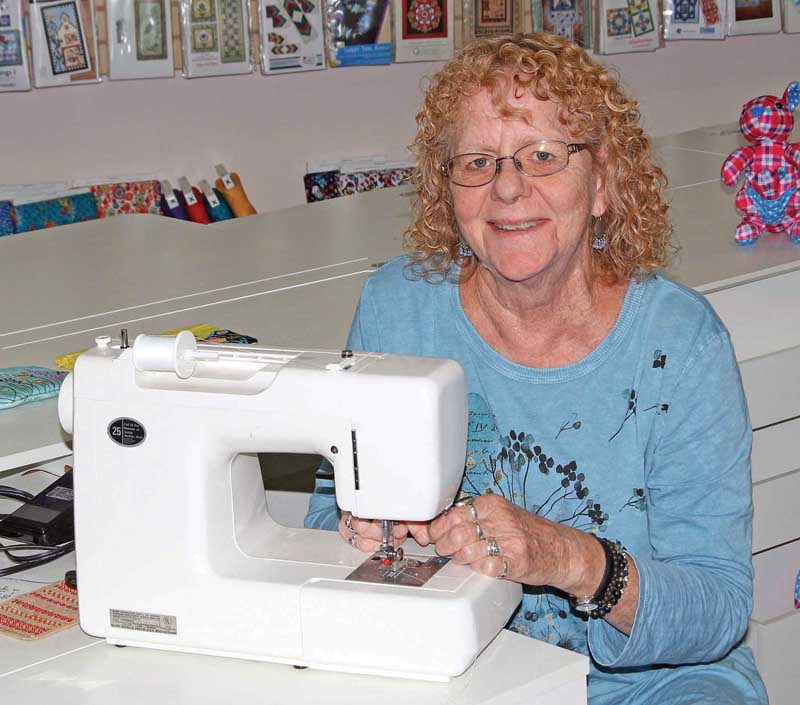 Bonnie Welsch was busy treading a sewing machine for a customer.