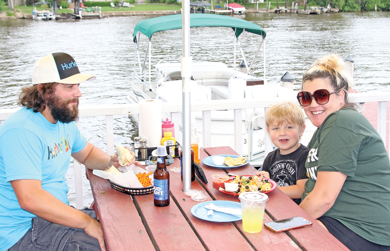 Brandon, Lynsie and Nash Mucha were enjoying a riverside lunch.