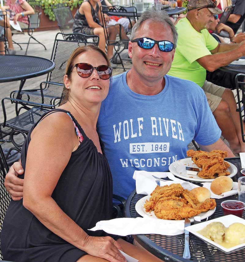 Darline and Mark Braun enjoy lunch together along the shores of the Wolf River.