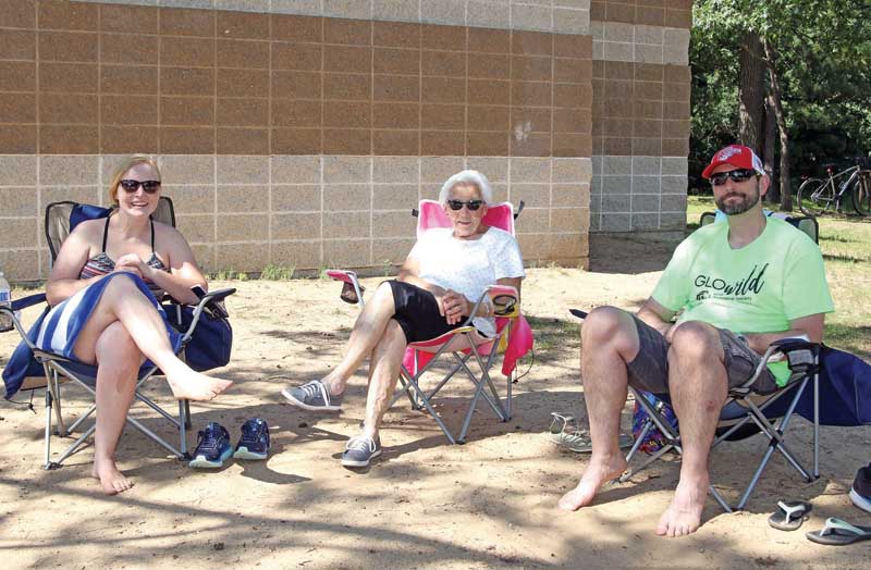 Sarah Yonts, Doris Thomas and Shaun Yonts found a shady area to sit while visiting South Park Beach.