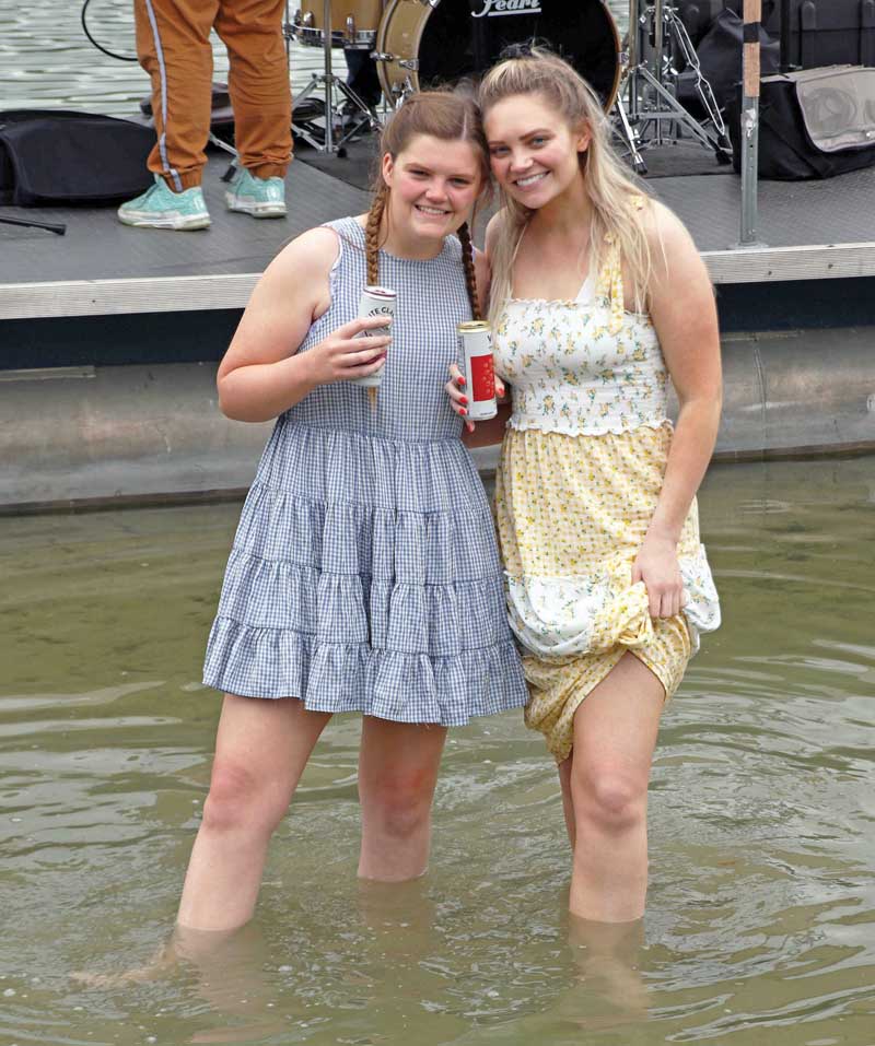 Abby and Madeline Mortensen cool off in Taylor Lake.