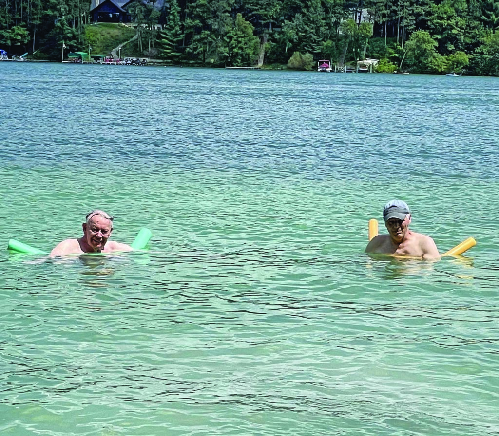 Dick Abb and John Abb take an early morning swim.