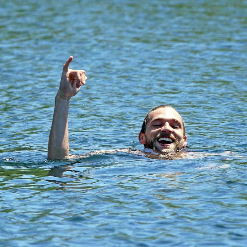 Patrick was all smiles while swimming across Beasley Lake.