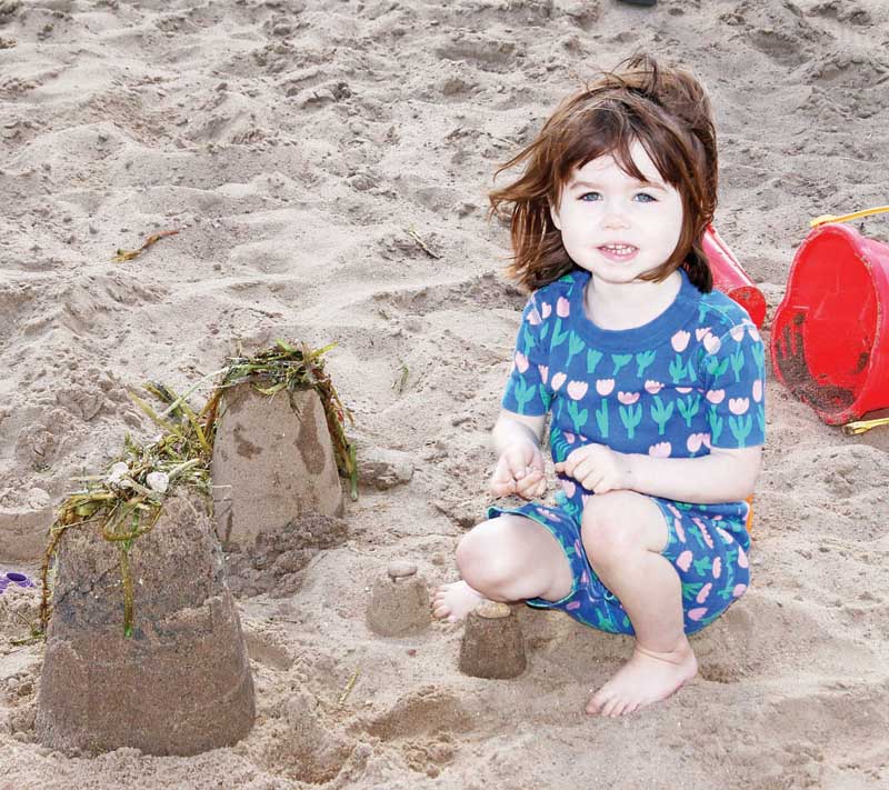 Stella Mae Albert was busy making sand castles at the beach.