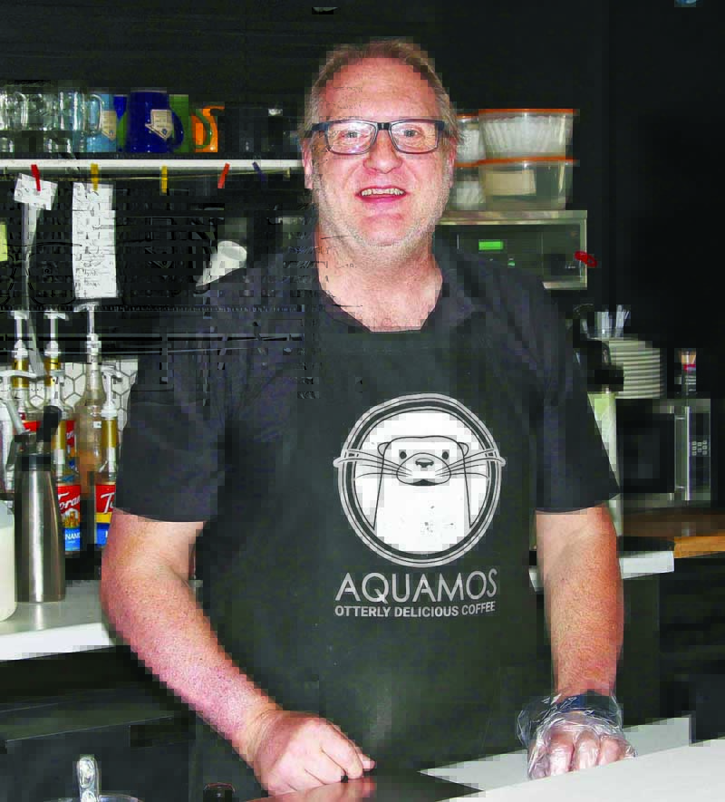 Wayne Cain was hard at work at the Aquamos Coffee shop.