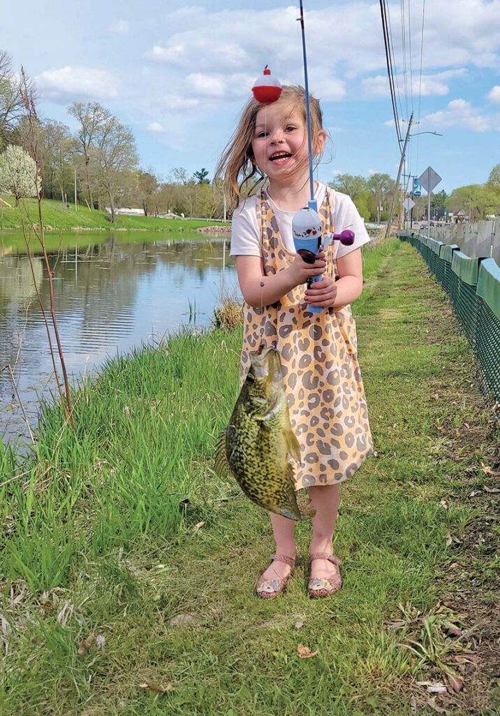 Novalyn Anunson, 5, was excited to catch this 10” crappie while fishing on the Crystal River Mill Pond.