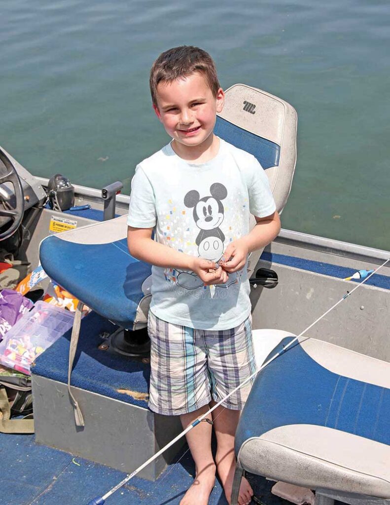 Sawyer Eggleston, 6, was trying his luck at fishing on Taylor Lake.