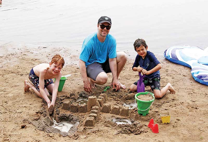 Future architects Eamon and Esben Enright were making sand castles with their uncle Joseph Holtane.