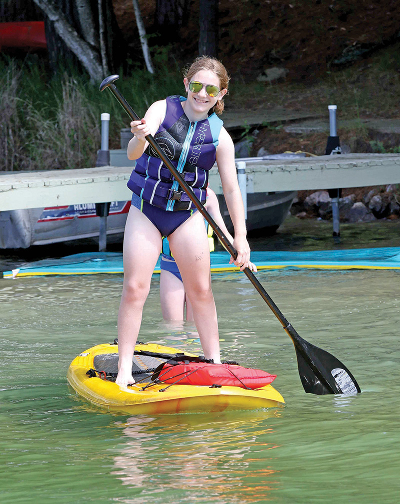 Sam Fisher was all smiles on her stand-up paddle board.