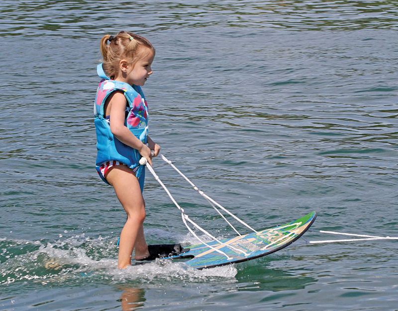 Three-year-old Amelia Lewitzke water skiing on Rainbow Lake.