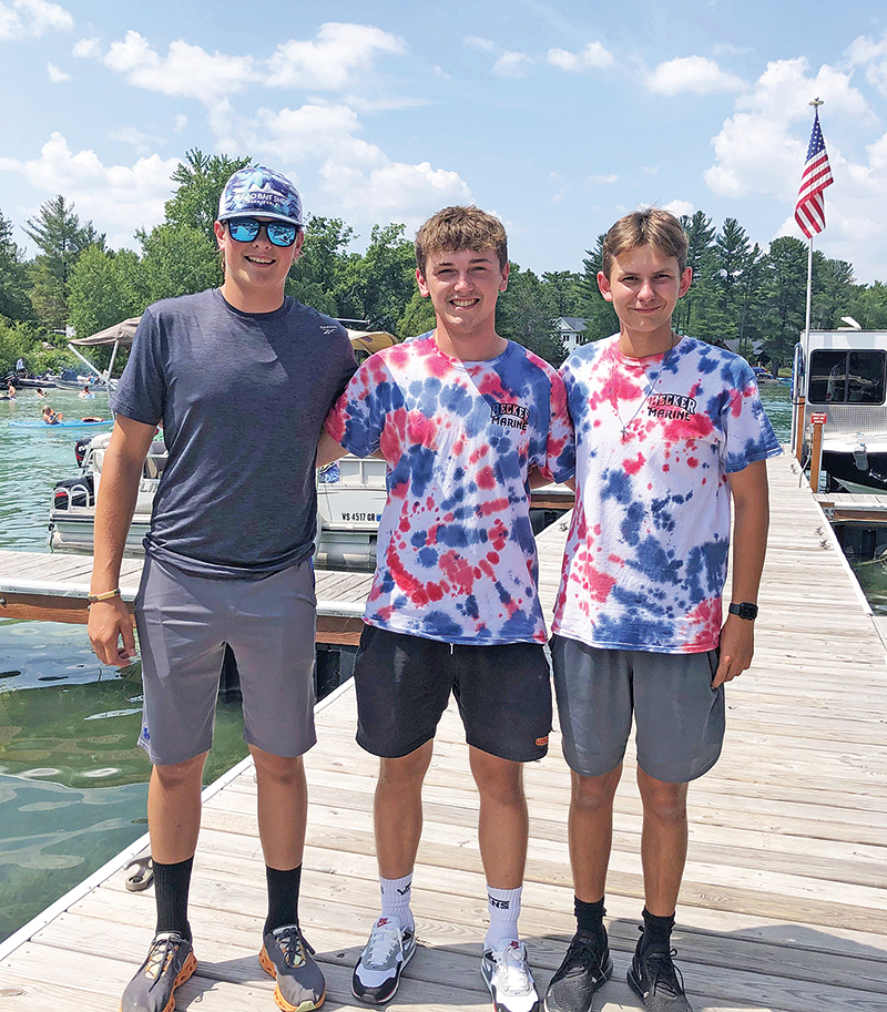 Brock Huebner, Tyler Schroeder, and John Kirk are spending their summer working at Becker Marine on the Chain.