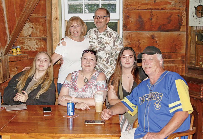 Kirk, Nikkitah, Renee and Savannah Ibe, along with Greg and Tanya Peotter were listening to music at the Iola Mill during Taste and Tunes of Iola-Scandinavia.