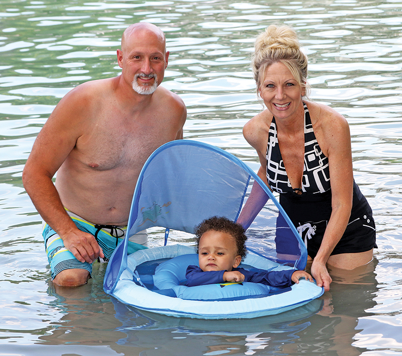 Paul Desrochers and Lori Henderson brought 1-year-old Harlem to the Chain O’ Lakes to cool off on a hot summer day.