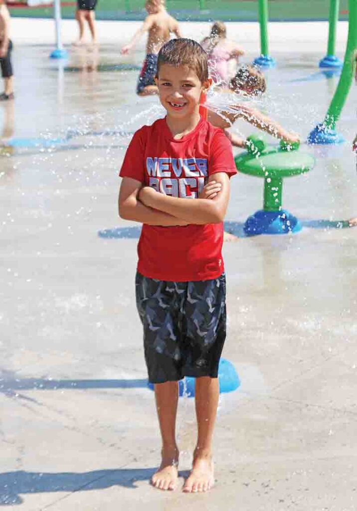 James Smith was all smiles while visiting the splash pad.