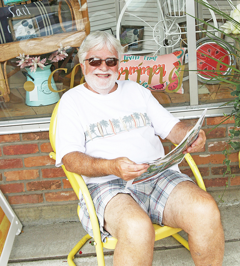Steve Mastronardi was caught reading the Picture Post will visiting downtown Waupaca.